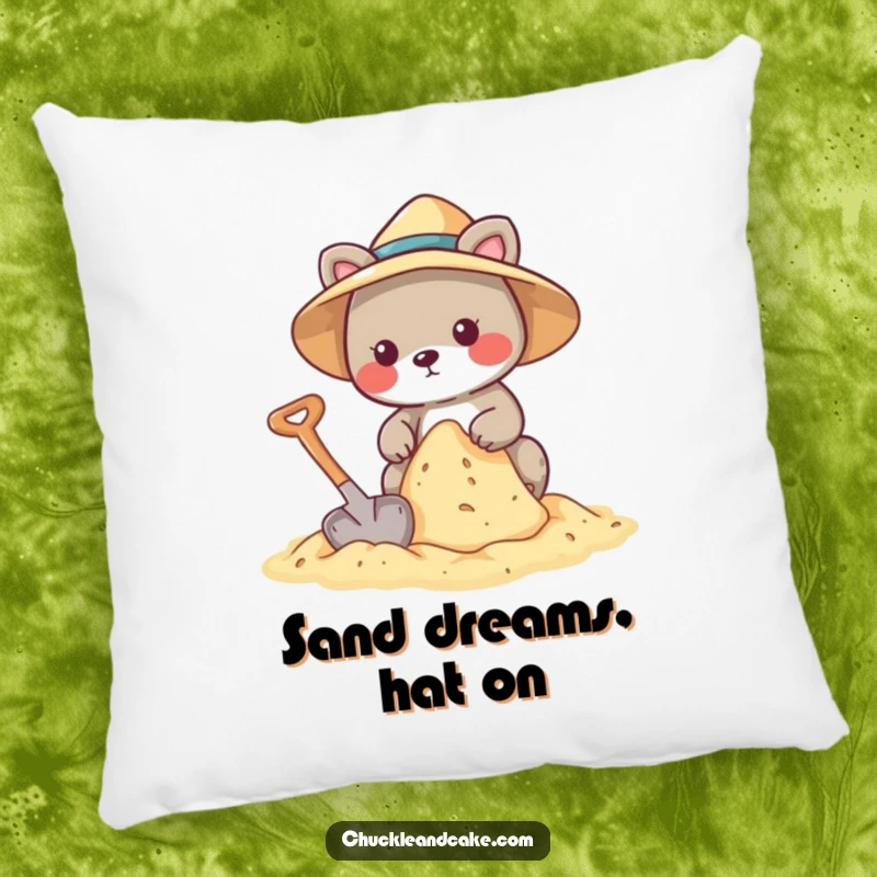 Funny pillow with an animal wearing a sun hat, building a sandcastle with a shovel.