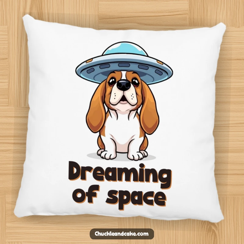 Funny Basset Hound pillow showing a curious dog looking up at a flying saucer, ideal for cozy mystery comfort.