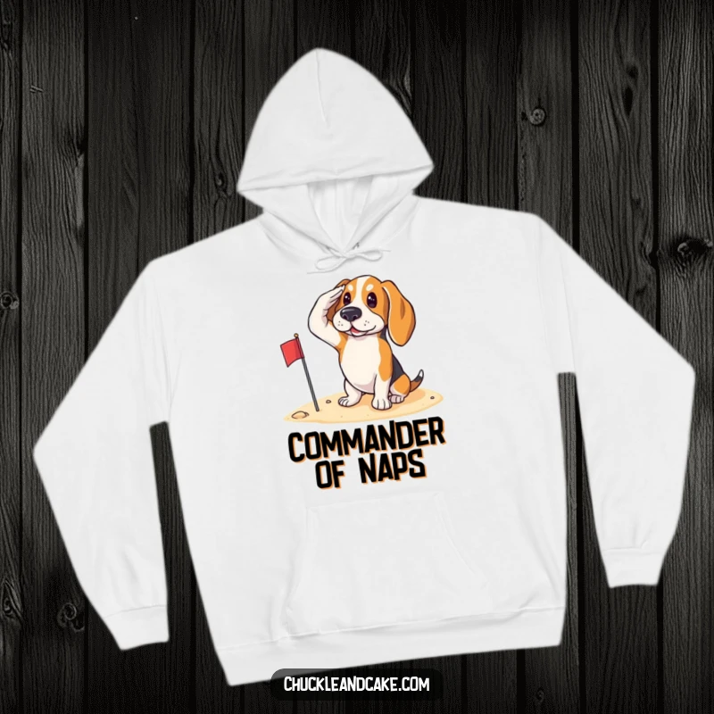 Funny Basset Hound saluting with a small flag on the sand, ready for patriotic duty, featured on a warm hoodie.