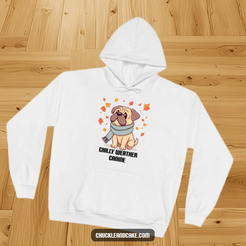 Funny hoodie featuring a Bullmastiff dog wearing a scarf, looking at falling leaves, bringing cozy autumn vibes.