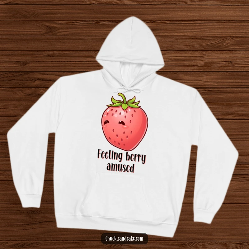 Funny strawberry with leaves giggling uncontrollably, a cozy hoodie featuring a tickled fruit character in a hilarious fit of laughter.