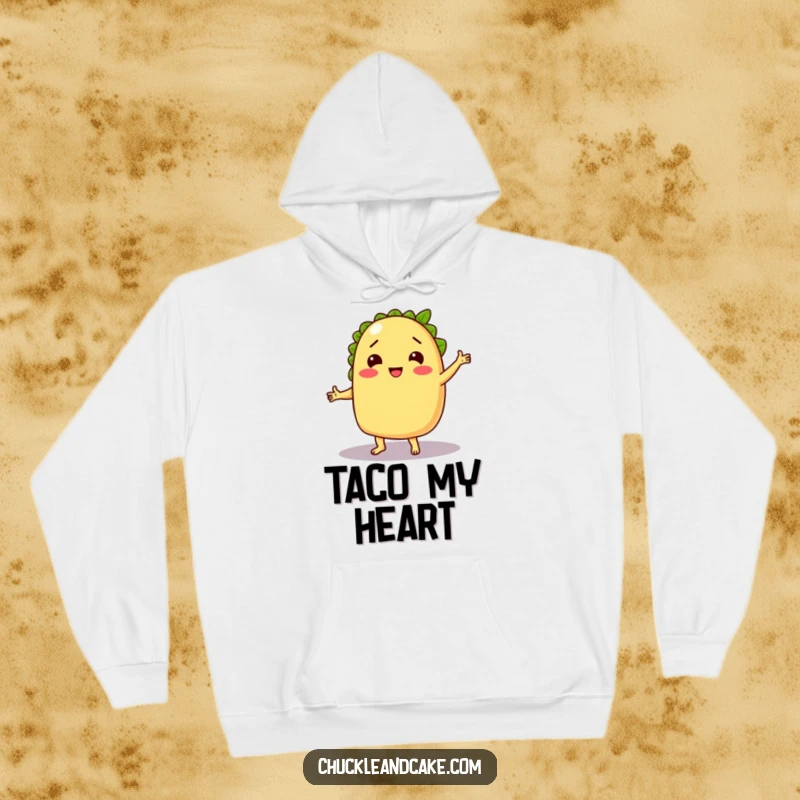 Funny hoodie featuring a chuckling taco dancing with a lime, offering cozy comfort and festive, humorous vibes.
