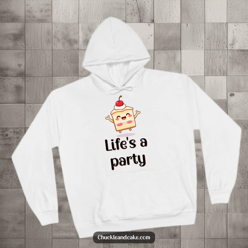 Funny slice of cake with a cherry on top beaming and jumping, a cozy hoodie featuring a celebratory dessert character.