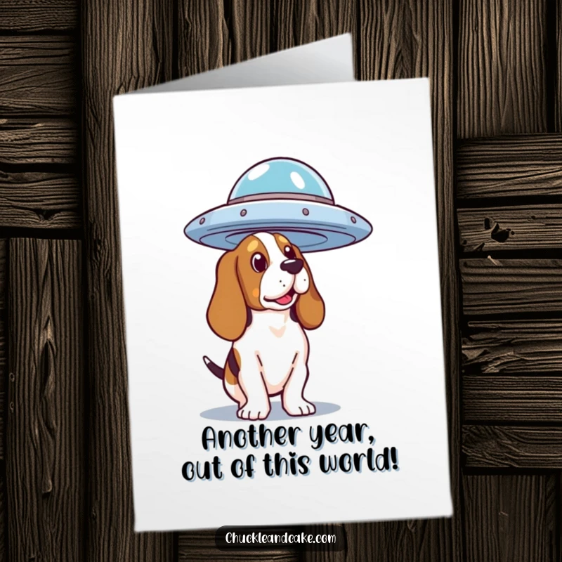 Funny Free Printable Birthday Card: Basset Hound gazing curiously upwards at a hovering, mysterious flying saucer.