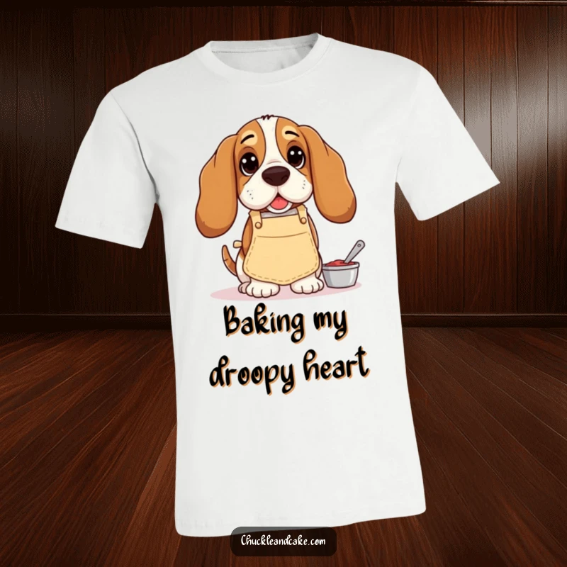 Funny Basset Hound t-shirt, droopy-eared dog in a tiny apron, happily baking, conveying a humorous and lovable personality.