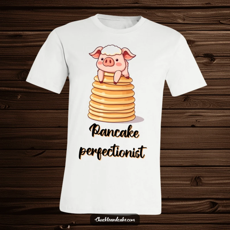 Funny sheepish pig balancing a tower of pancakes on a t-shirt, comical and adorable breakfast-themed apparel.
