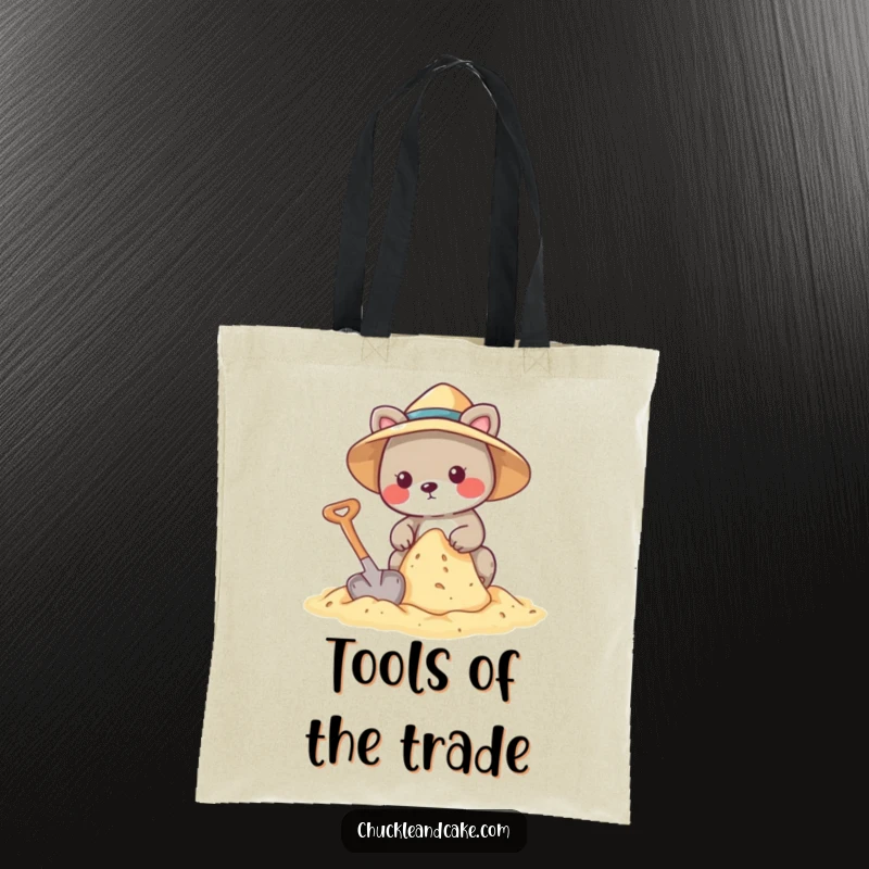 Funny tote bag showcasing an animal wearing a sun hat, building a sandcastle with a shovel.